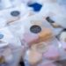 Close-up of heart-shaped candies packaged with personalized thank you labels, ideal for gifts.